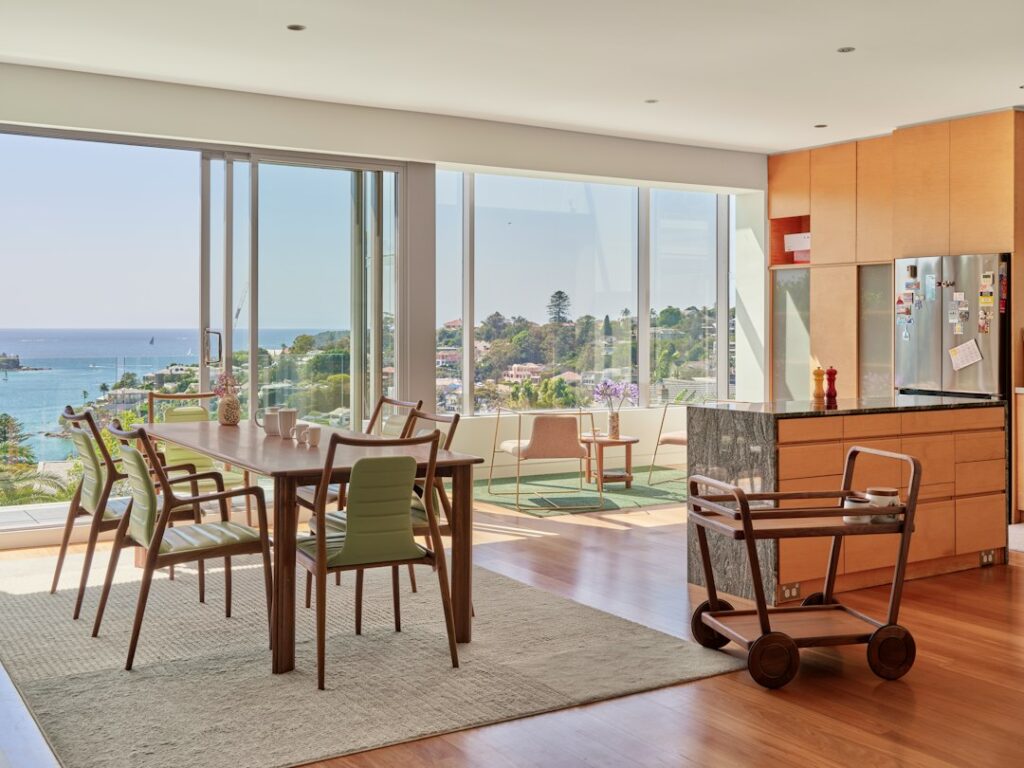 A modern dining room overlooks a beautiful view