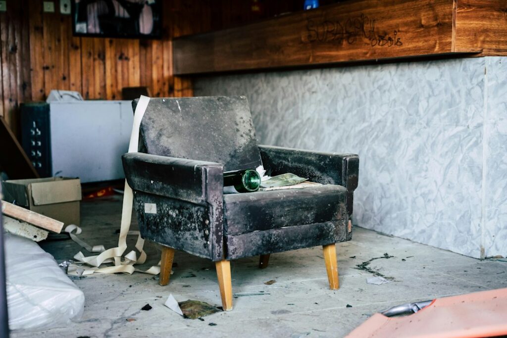 black wooden bench near white wall