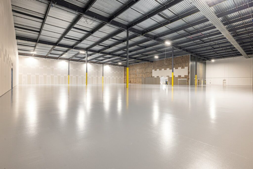 Empty industrial warehouse with polished concrete floor